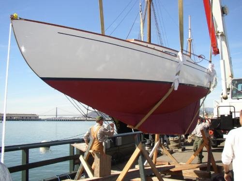 Merry Bear being lowered into the water at Hyde Street Pier for her 80th birthday celebration